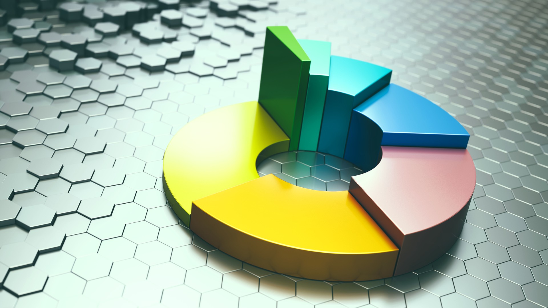 Abstract metallic donut chart on a shiny hexagonal surface. Close up defocused composition.