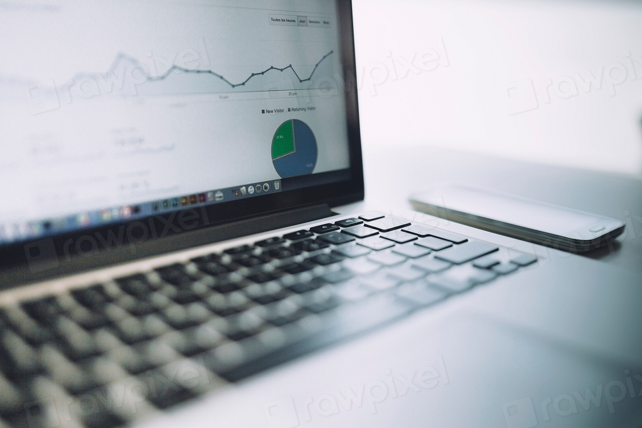 Laptop and phone displaying analytics charts
